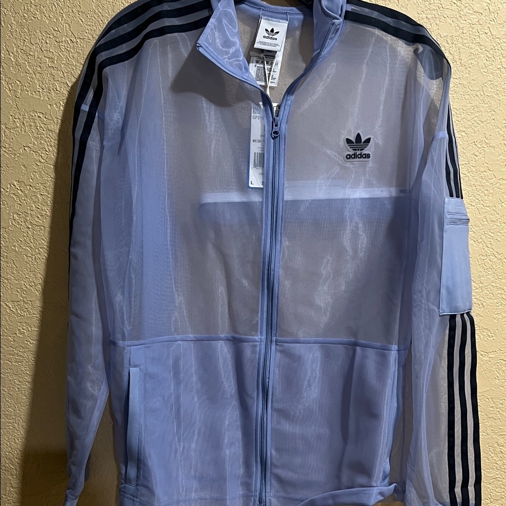 💙💙 SOLD SOLD SOLD 💙💙

Adidas Light Blue Sheer Track Jacket with Black Stripes-